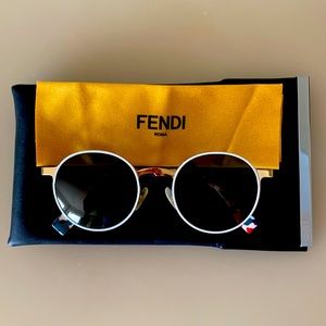 FENDI sunglasses, round frames with gold and white rims. Sides are multicolored